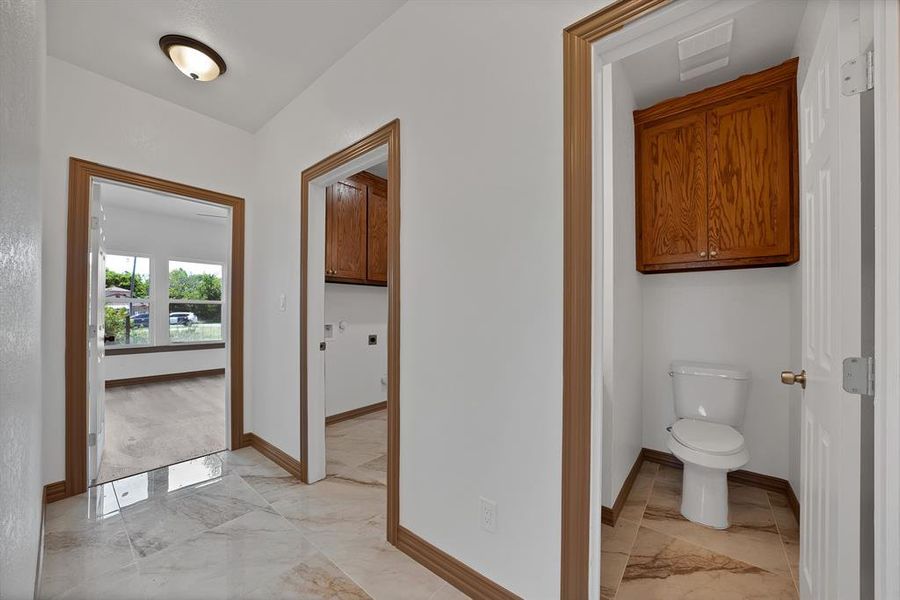 Bathroom with light marble finish floors