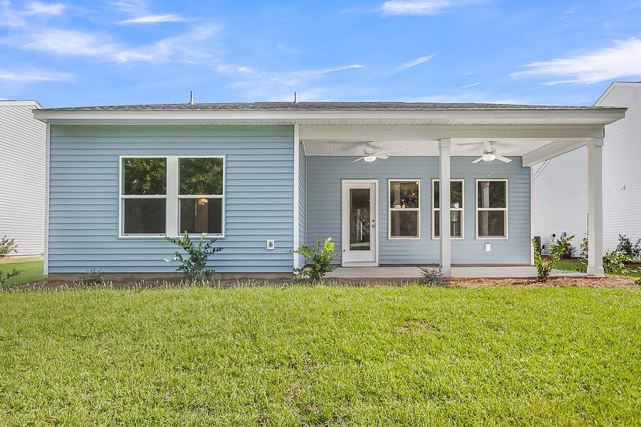 Exterior details and patio area of a home in Fairway Woods at Wyboo, Manning (Image 24).