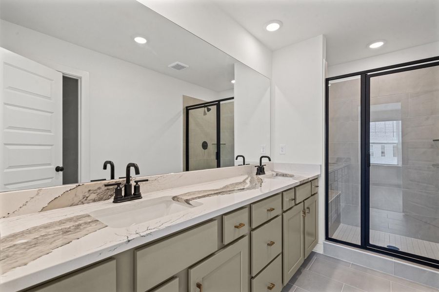 Dual sink vanity with stone countertop and matte black fixtures