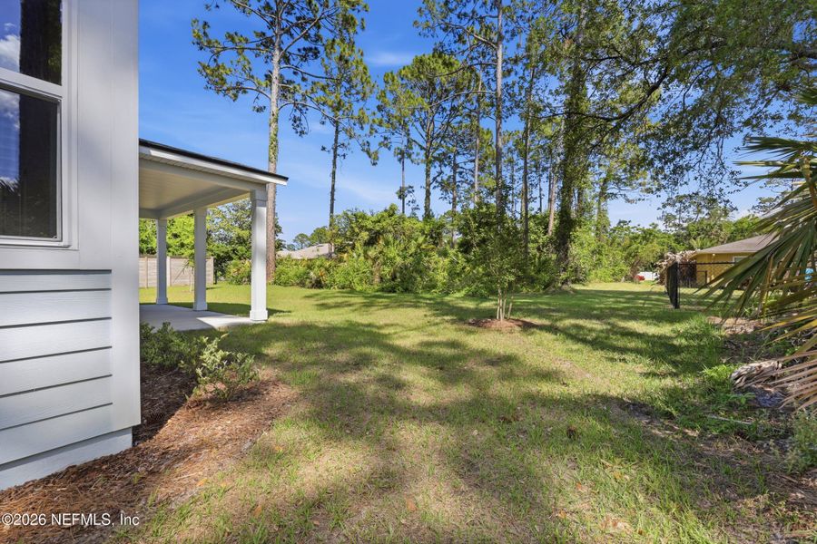 Exterior details and patio area of a home in Palm Coast Homes, Palm Coast (Image 4).