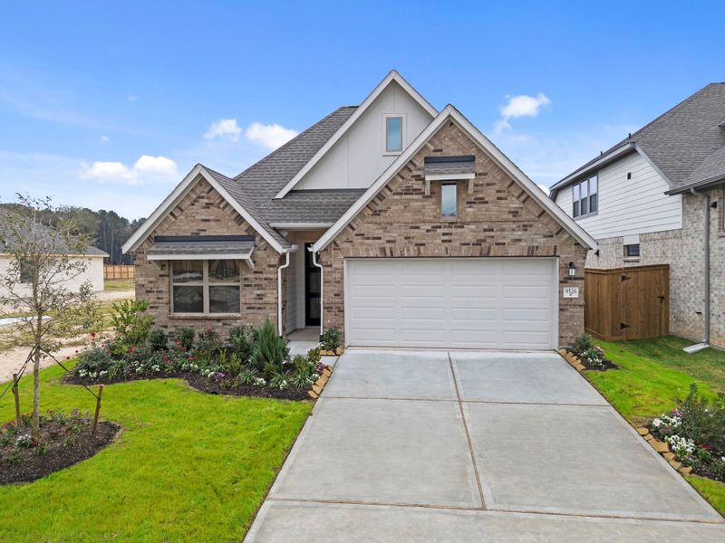 Front exterior of a new home in The Highlands, Porter, TX, highlighting curb appeal (Image 24).