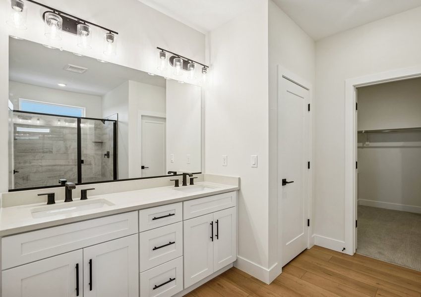 The master bathroom has a beautiful dual-sink vanity.