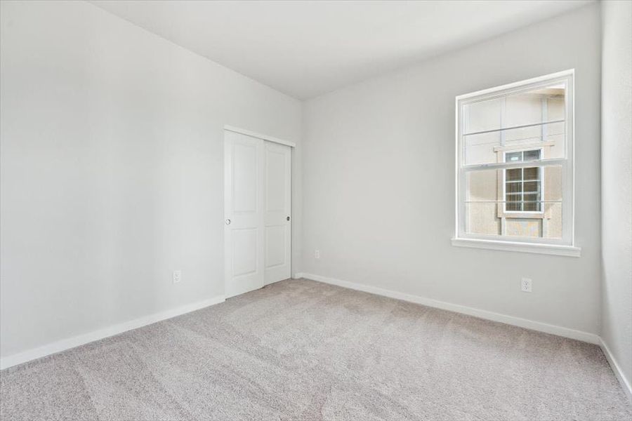A room with white walls and a window. A room with white walls and a window.