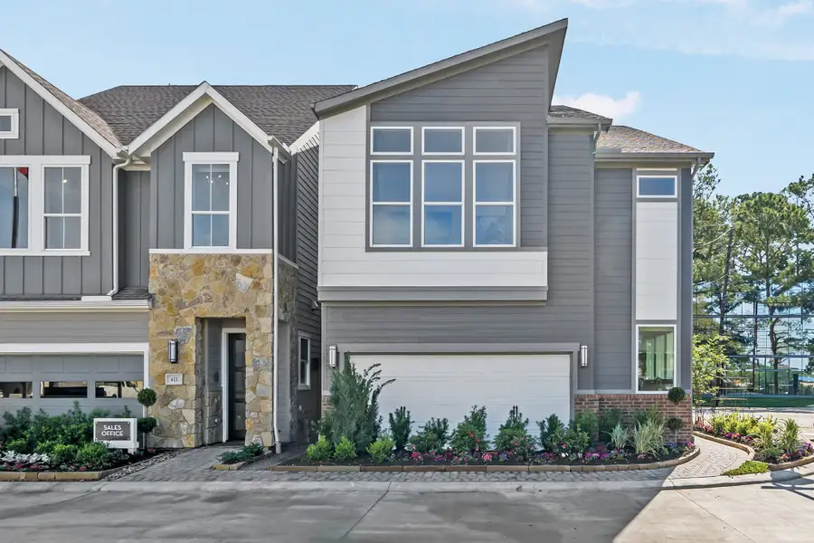 Front exterior of a new home in Retreat at Oak Park, Houston, TX, highlighting curb appeal (Image 2). Front exterior of a new home in Retreat at Oak Park, Houston, TX, highlighting curb appeal (Image 2).
