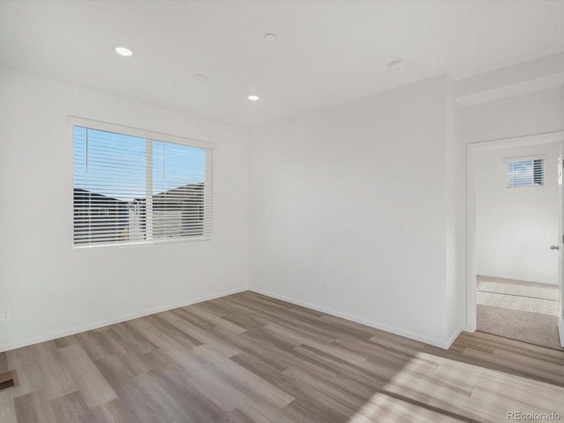 Spacious, unfurnished interior of a new home in Buffalo Highlands: The Flora Collection, Commerce City (Image 10).