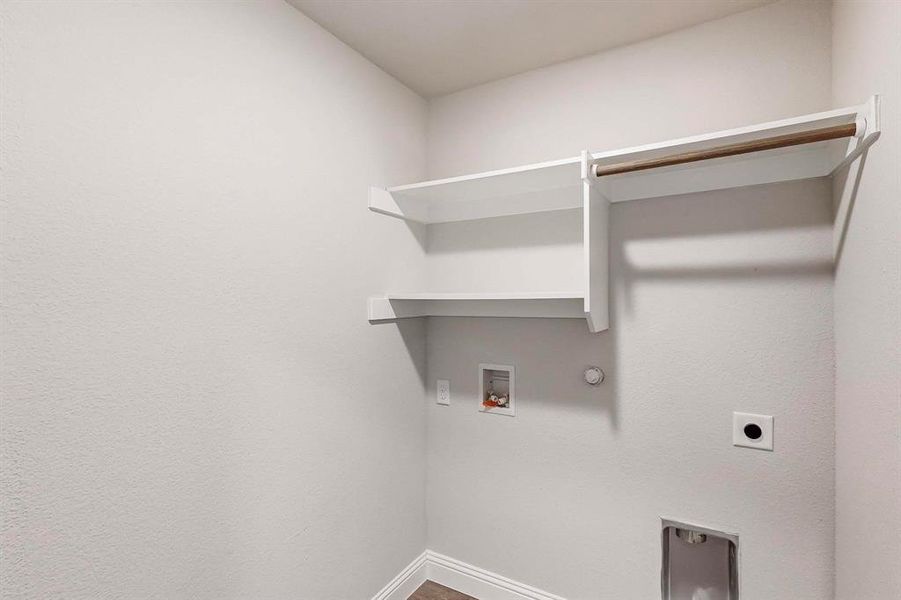 Washroom featuring gas dryer hookup, hookup for an electric dryer, and washer hookup