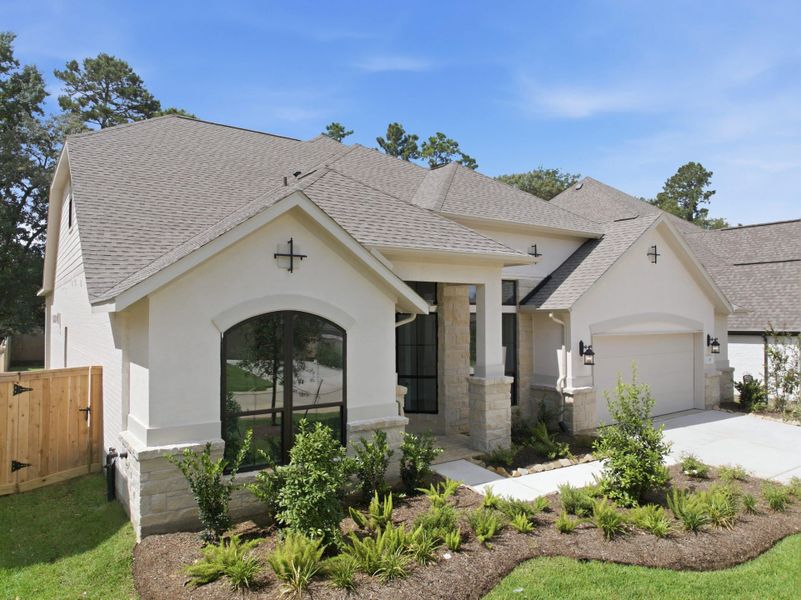 Front exterior of a new home in The Woodlands Hills 65′, Willis, TX, highlighting curb appeal (Image 27).