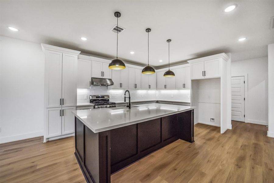 Open concept kitchen with island.