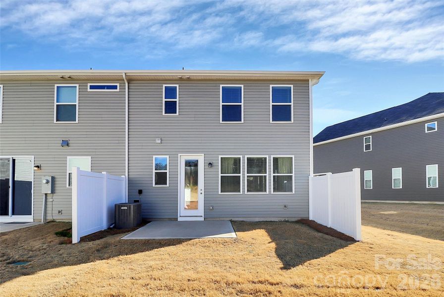 Exterior details and patio area of a home in Porter's Row, Charlotte (Image 4). Exterior details and patio area of a home in Porter's Row, Charlotte (Image 4).