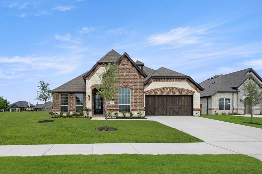 Front exterior of a new home in Redden Farms, Midlothian, TX, highlighting curb appeal (Image 1). Front exterior of a new home in Redden Farms, Midlothian, TX, highlighting curb appeal (Image 1).