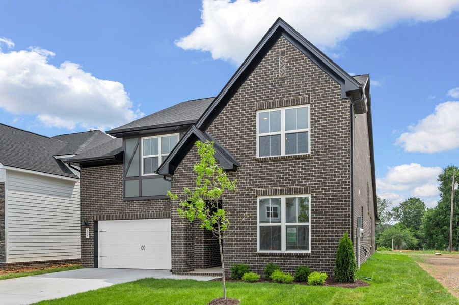 Front exterior of a new home in Woods Crossing, Gallatin, TN, highlighting curb appeal (Image 28).