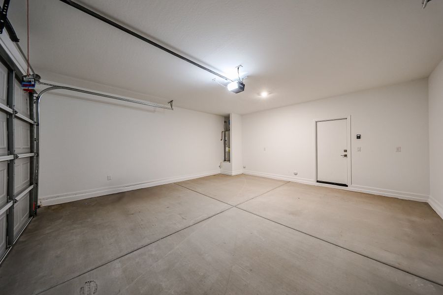 A room with a wood floor and white walls.