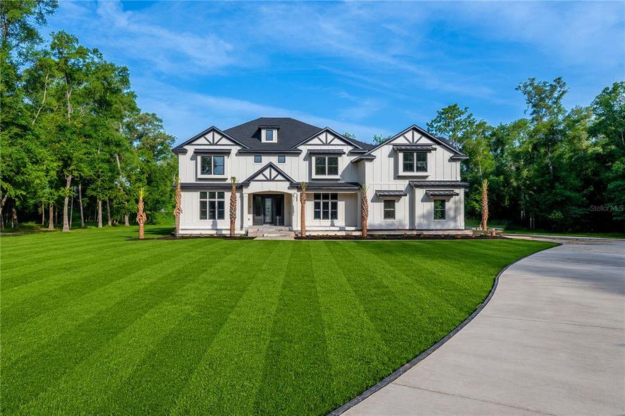 Front exterior of a new home in , High Springs, FL, highlighting curb appeal (Image 6).