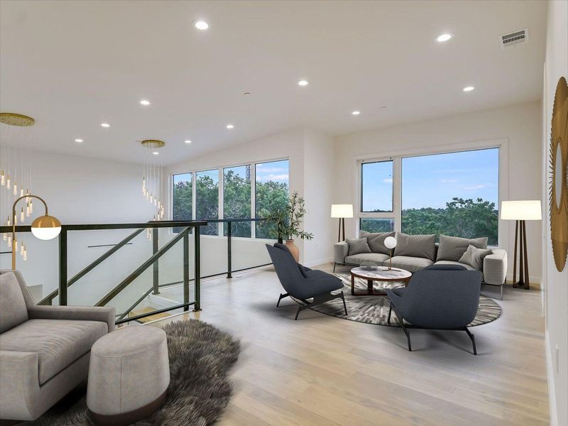 Natural light pours into this living space, revealing polished hardwood flooring and abundant recessed lighting. Natural light pours into this living space, revealing polished hardwood flooring and abundant recessed lighting.