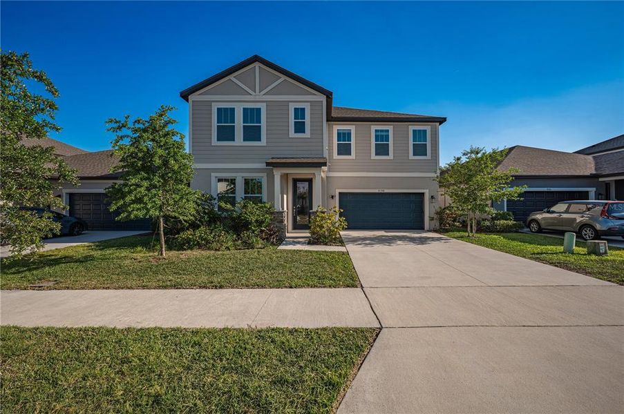 Front exterior of a new home in , Orlando, FL, highlighting curb appeal (Image 11). Front exterior of a new home in , Orlando, FL, highlighting curb appeal (Image 11).