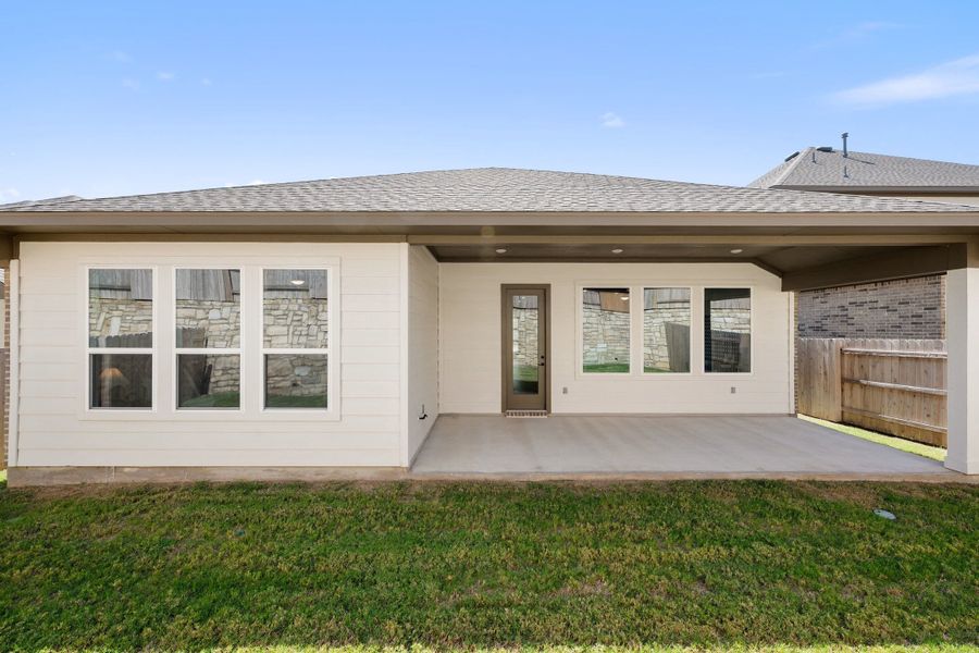Exterior details and patio area of a home in Lariat, Liberty Hill (Image 30).