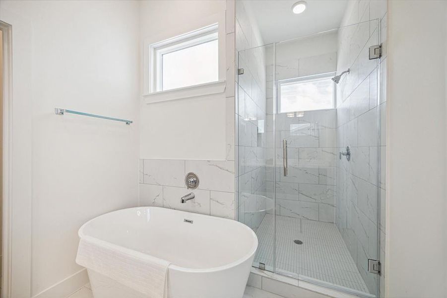 Master Soaking Tub and Glass Enclosed Shower