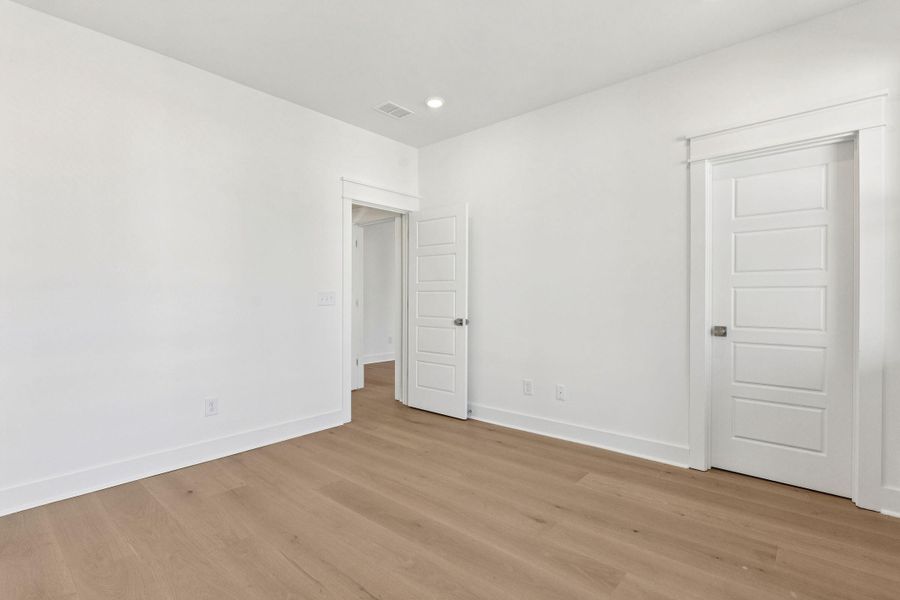 Spacious, unfurnished interior of a new home in Overlook at Copahee Sound, Awendaw (Image 52).