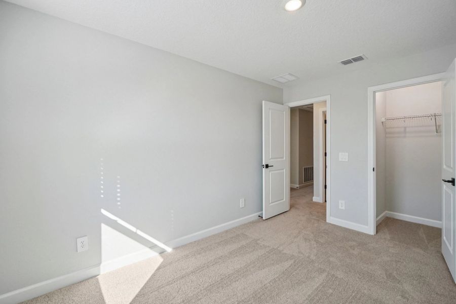 Bedroom 2 features a roomy walk-in closet