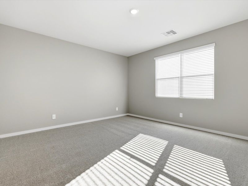 Spacious, unfurnished interior of a new home in White Tank Foothills Signature Series, Waddell (Image 10).