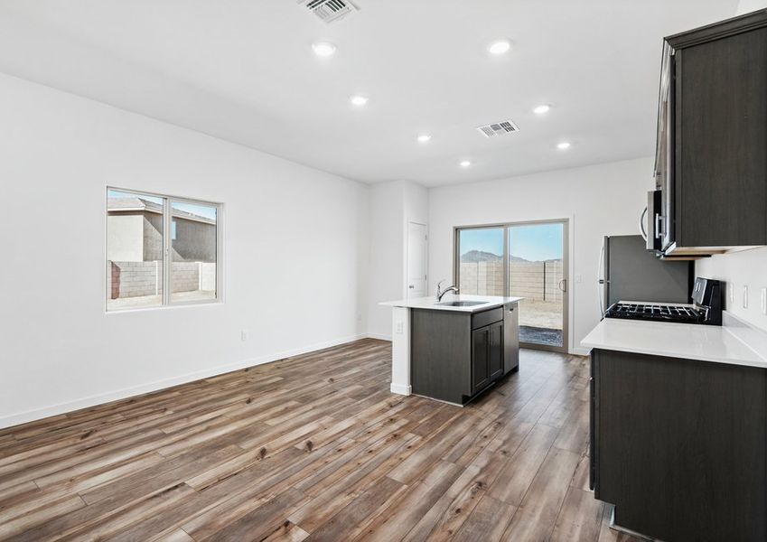 Sliding glass doors bring in natural lighting in the living area.
