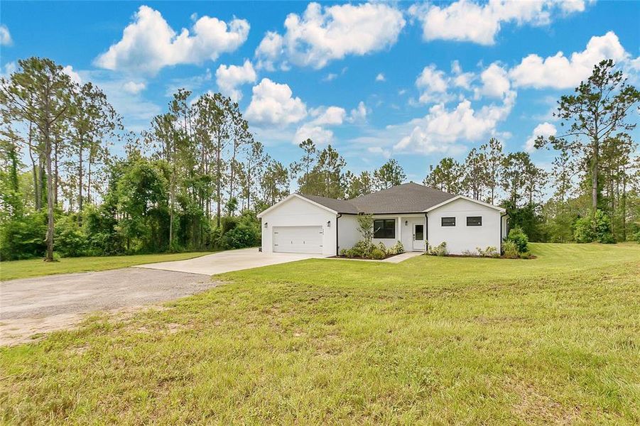 Front exterior of a new home in , Groveland, FL, highlighting curb appeal (Image 27). Front exterior of a new home in , Groveland, FL, highlighting curb appeal (Image 27).