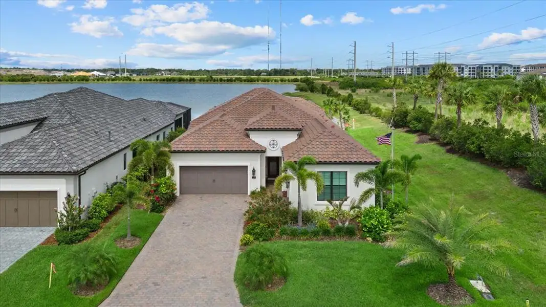 Front exterior of a new home in , Nokomis, FL, highlighting curb appeal (Image 2). Front exterior of a new home in , Nokomis, FL, highlighting curb appeal (Image 2).