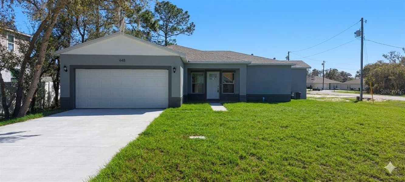 Front exterior of a new home in , Kissimmee, FL, highlighting curb appeal (Image 2). Front exterior of a new home in , Kissimmee, FL, highlighting curb appeal (Image 2).