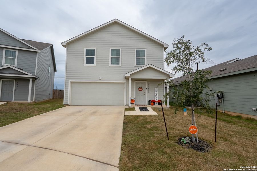 Front exterior of a new home in Mission del Lago: Cottage Collection, San Antonio, TX, highlighting curb appeal (Image 1).