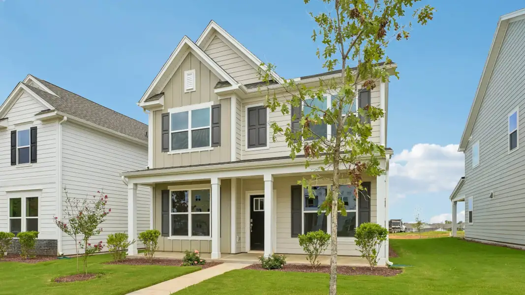 Front exterior of a new home in Collins Ridge, Hillsborough, NC, highlighting curb appeal (Image 21).