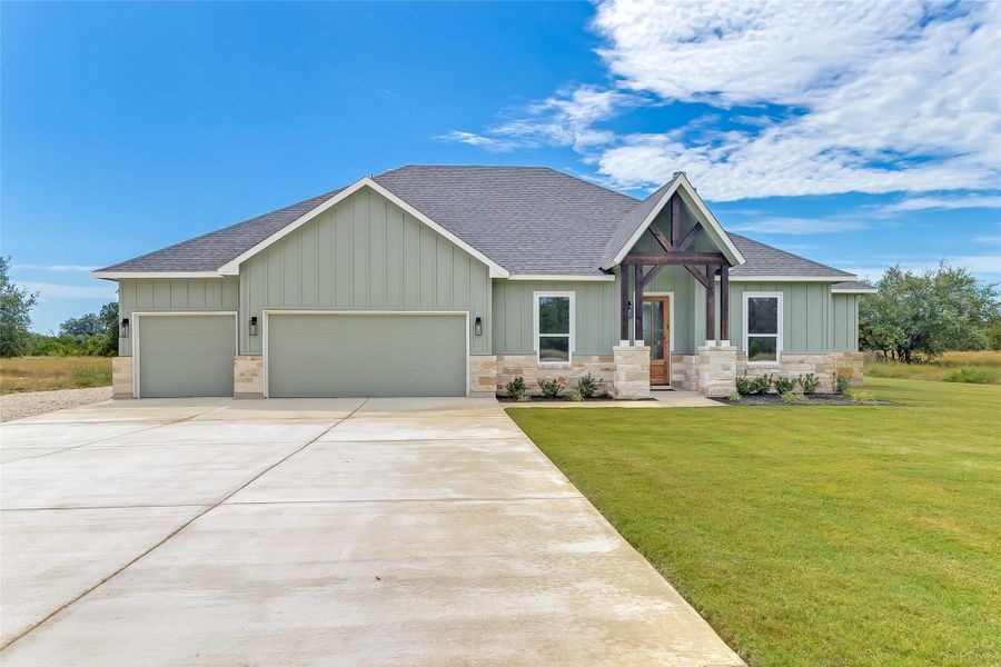 Front exterior of a new home in , Bertram, TX, highlighting curb appeal (Image 2). Front exterior of a new home in , Bertram, TX, highlighting curb appeal (Image 2).