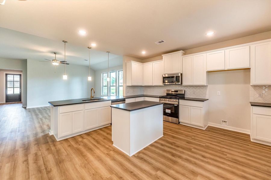 Furnished interior view inside a new home in Deer Pines, Conroe (Image 5).