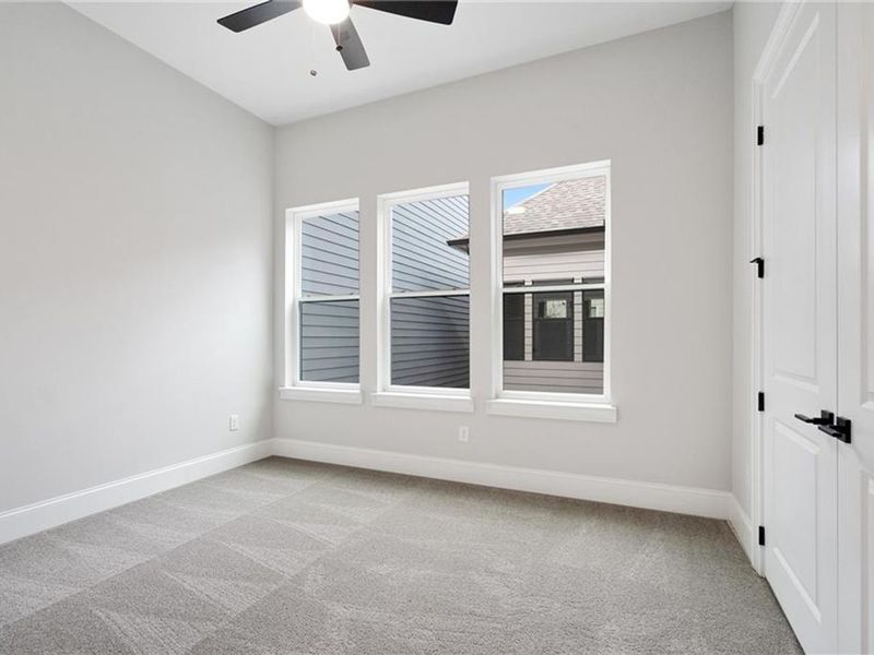 Spacious, unfurnished interior of a new home in The Village at Towne Lake, Woodstock (Image 26).