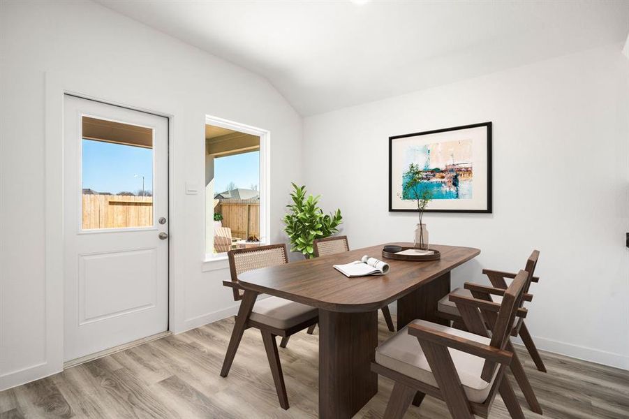 You and your guests will certainly dine in style in this amazing dining room! Featuring a large window, high ceilings, and vinyl plank flooring flooring. Perfect space to entertain family and friends.