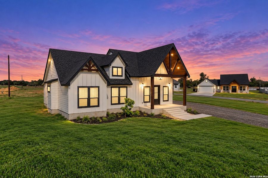 Front exterior of a new home in , Atascosa, TX, highlighting curb appeal (Image 26). Front exterior of a new home in , Atascosa, TX, highlighting curb appeal (Image 26).