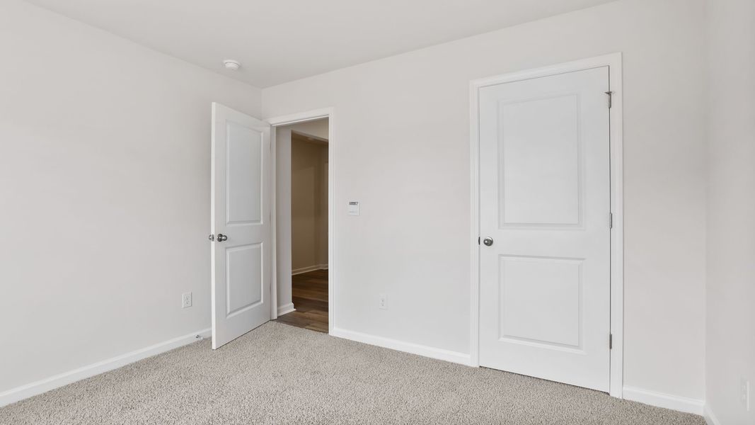 Spacious, unfurnished interior of a new home in Bentley Park, Greenwood (Image 14).