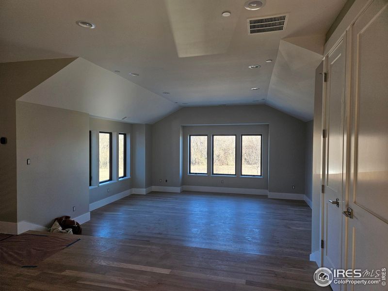 Recreation room that has views of Longs Peak and open space