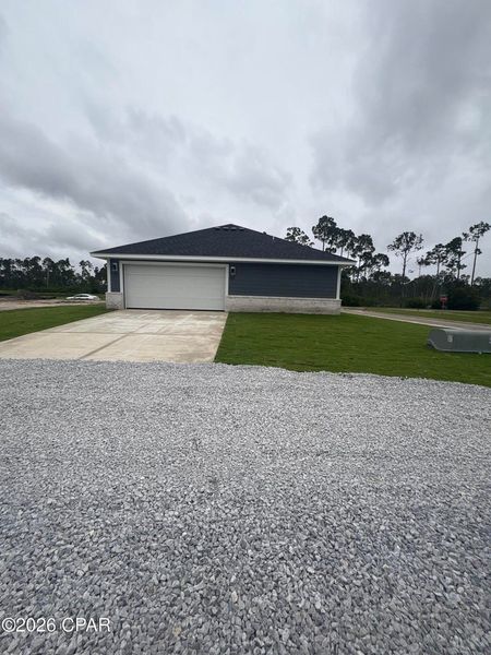 Front exterior of a new home in East Bay, Panama City, FL, highlighting curb appeal (Image 2). Front exterior of a new home in East Bay, Panama City, FL, highlighting curb appeal (Image 2).
