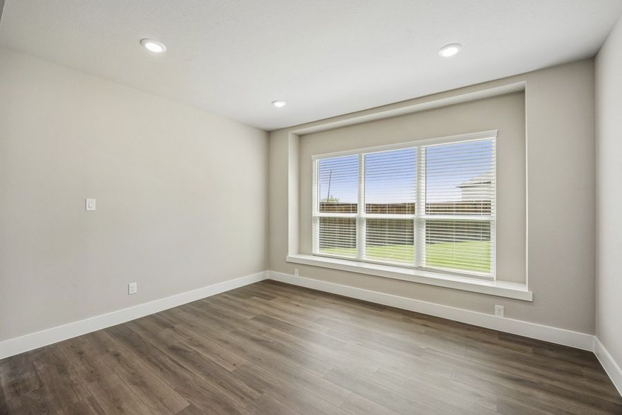 Representative unfurnished interior of a home built from the The Mockingbird by Lillian Custom Homes in Polo Ridge, Forney (Image 20).