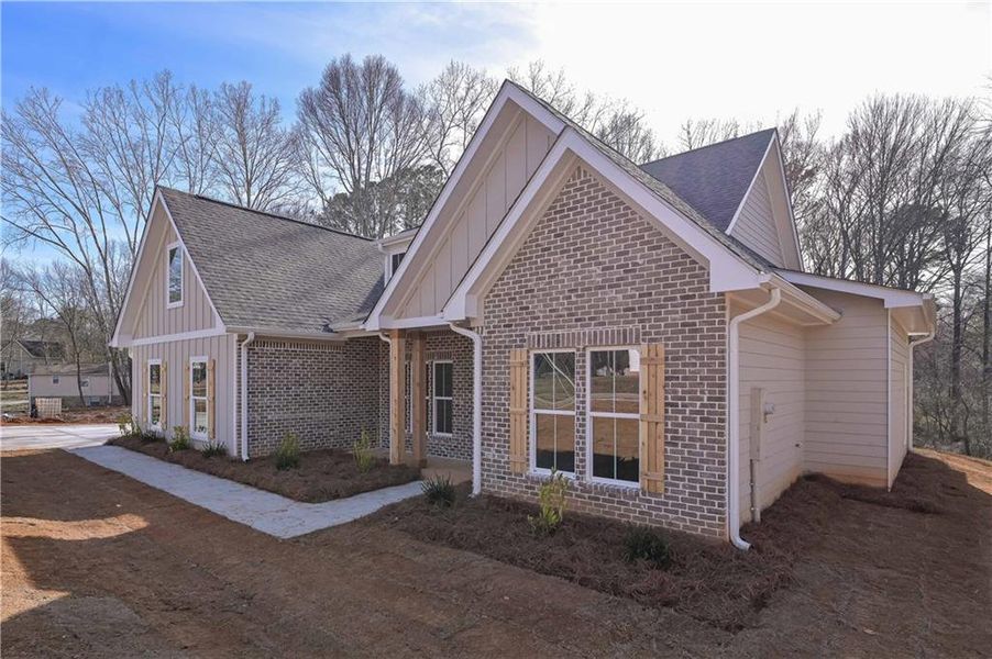 Front exterior of a new home in , Temple, GA, highlighting curb appeal (Image 18). Front exterior of a new home in , Temple, GA, highlighting curb appeal (Image 18).