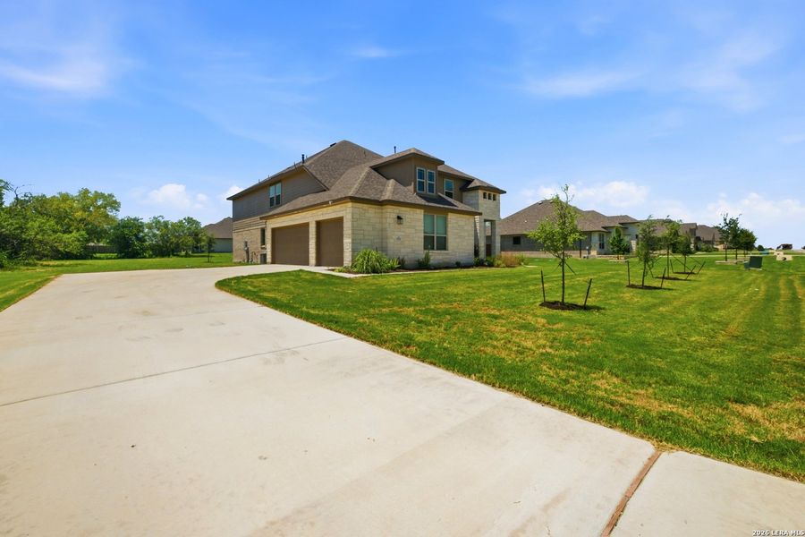 Front exterior of a new home in Everly Estates, San Antonio, TX, highlighting curb appeal (Image 2). Front exterior of a new home in Everly Estates, San Antonio, TX, highlighting curb appeal (Image 2).