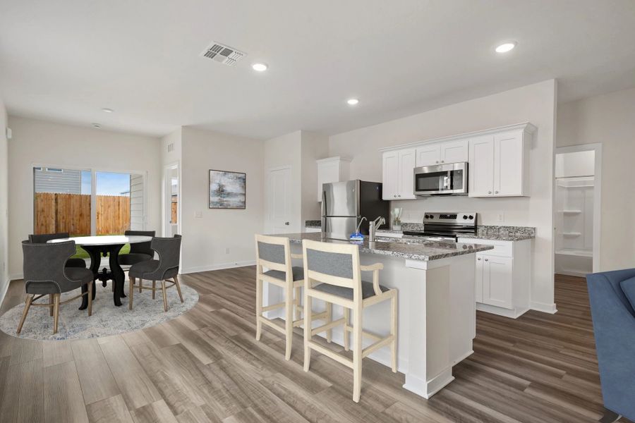 Representative furnished interior of a home built from the Odyssey by Starlight Homes in Oakfield Lakes, Parrish (Image 4).