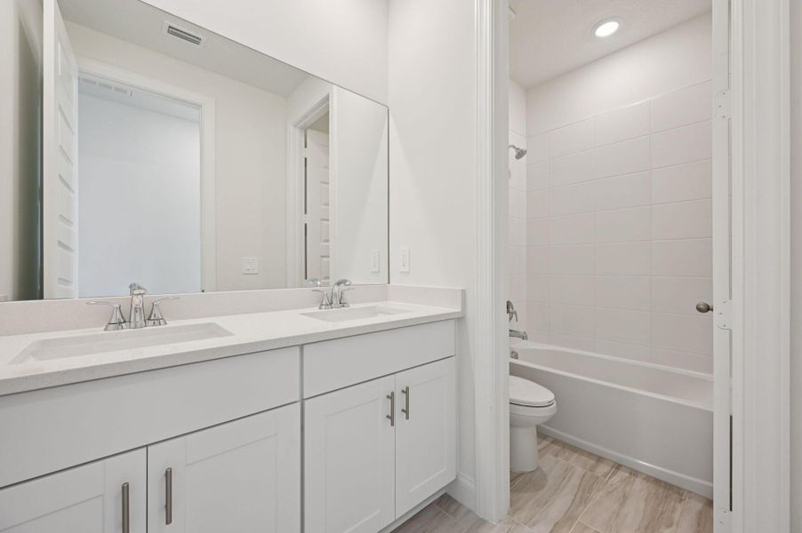 Furnished interior view inside a new home in Brystol at Wylder - Reserve Series, Port St. Lucie (Image 11).