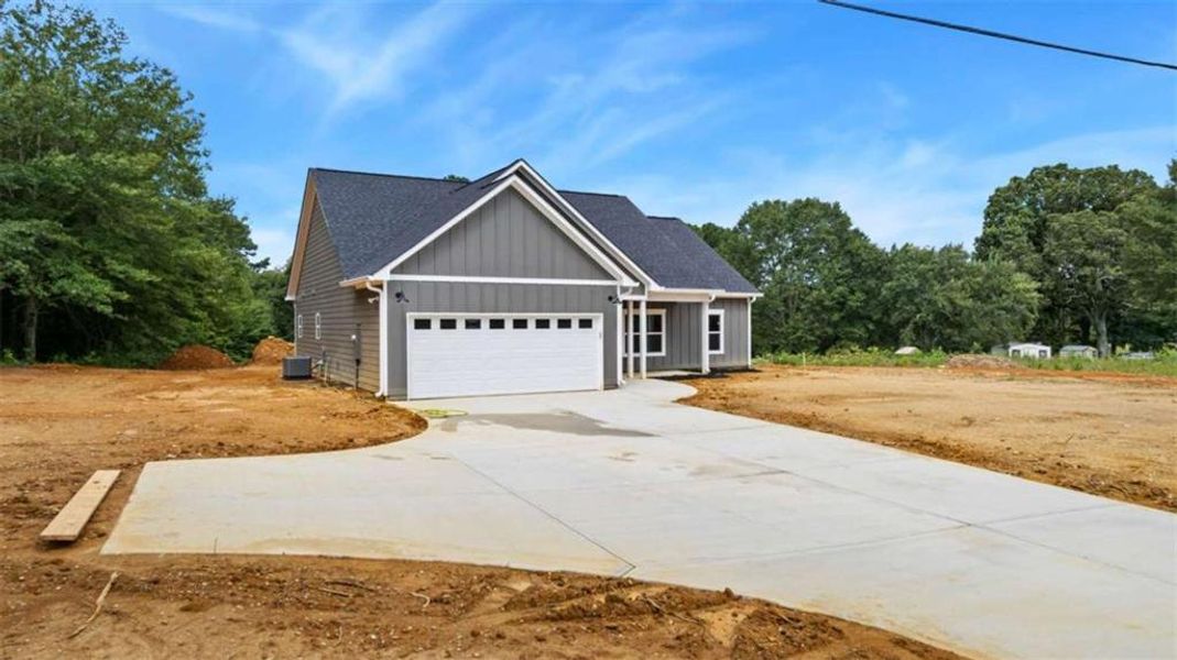 Front exterior of a new home in , Cedartown, GA, highlighting curb appeal (Image 15).