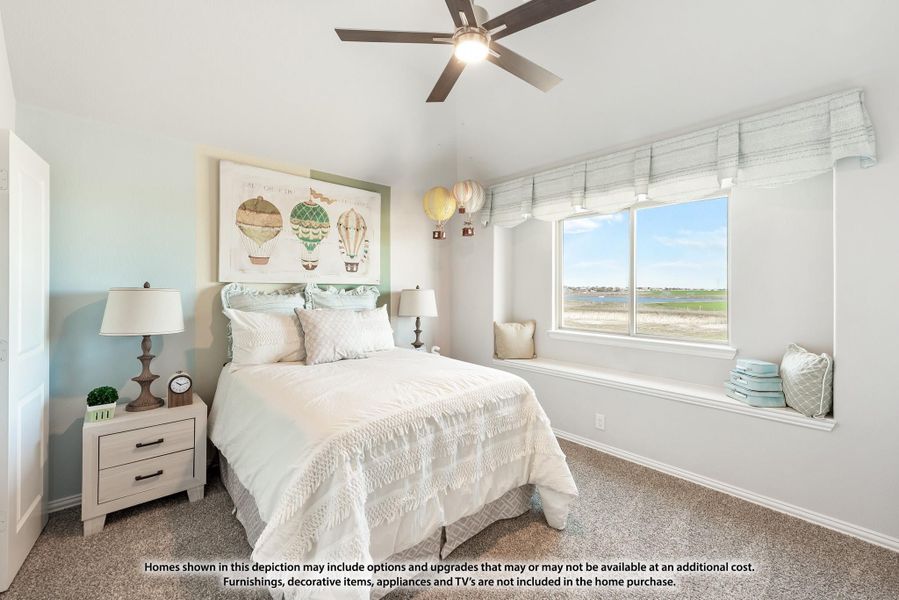 Bedroom with carpet, ceiling fan, window seat, and hot air balloon wall art above the bed Bedroom with carpet, ceiling fan, window seat, and hot air balloon wall art above the bed