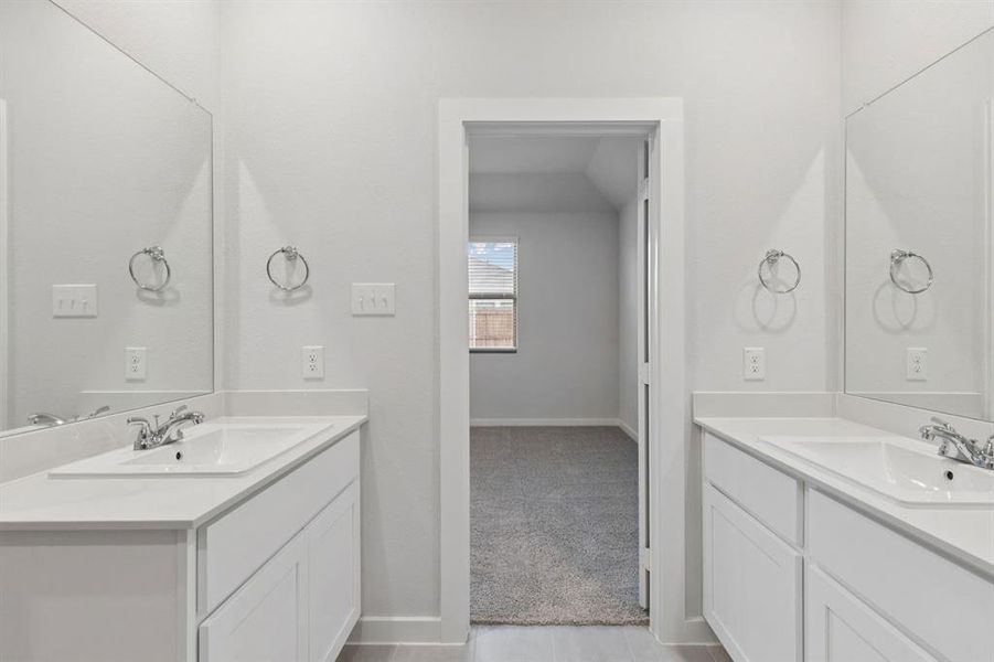 Primary Bathroom in the Cedar home plan by Trophy Signature Homes – REPRESENTATIVE PHOTO