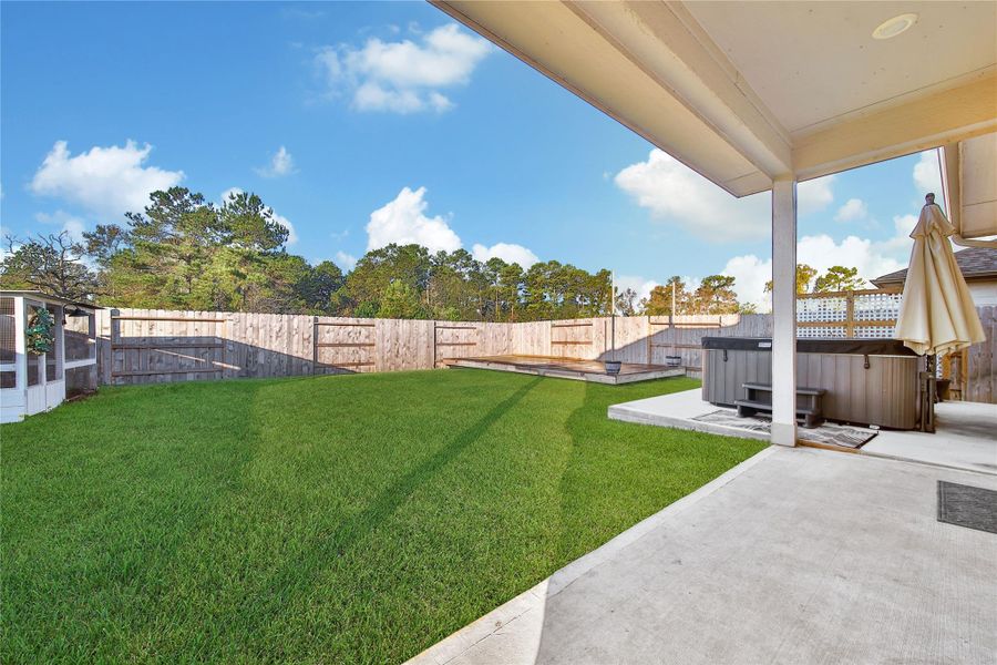 Exterior details and patio area of a home in Magnolia Place, Magnolia (Image 26).