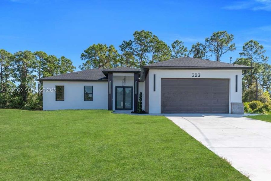 Front exterior of a new home in , Lehigh Acres, FL, highlighting curb appeal (Image 1). Front exterior of a new home in , Lehigh Acres, FL, highlighting curb appeal (Image 1).