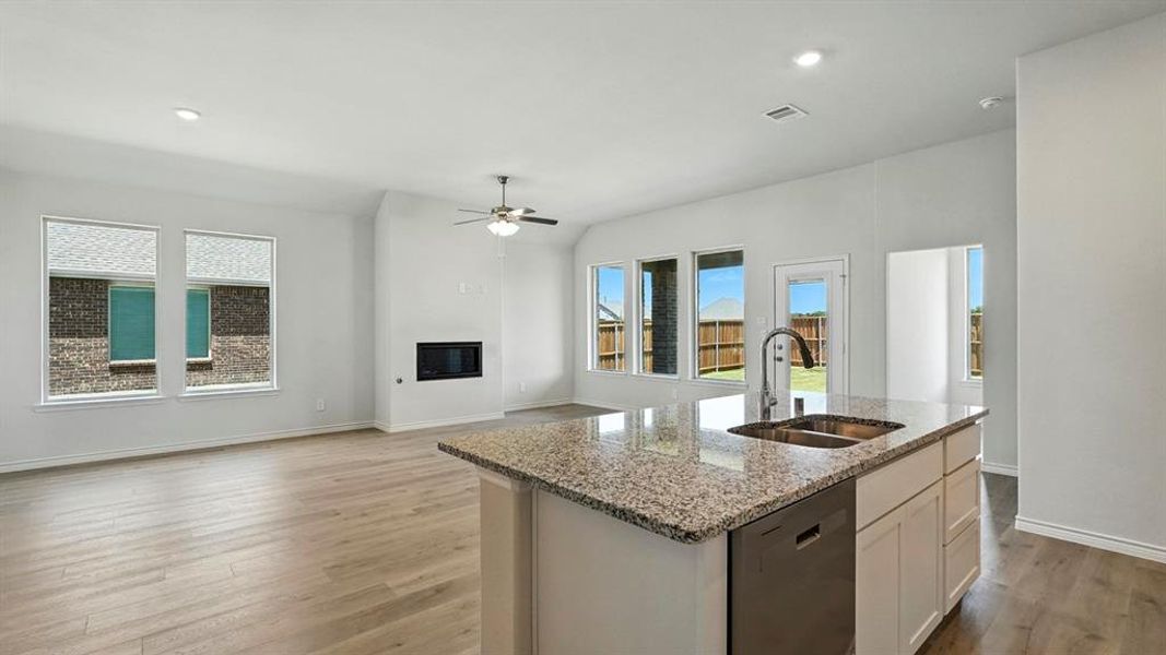 Kitchen island featuring a double-basin sink and integrated dishwasher Kitchen island featuring a double-basin sink and integrated dishwasher