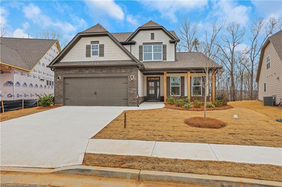 Front exterior of a new home in , Loganville, GA, highlighting curb appeal (Image 17).
